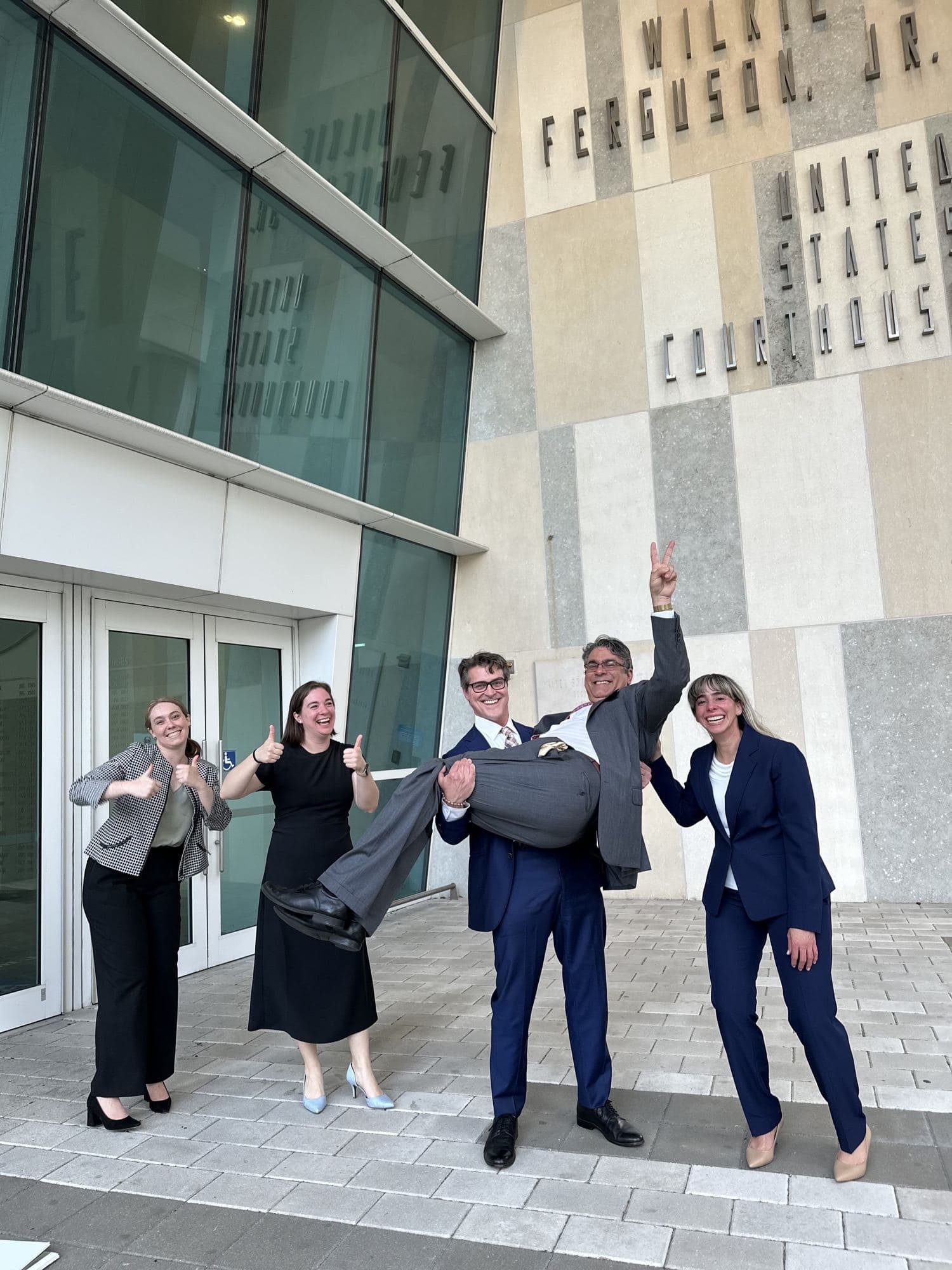 Celebrating a full acquittal outside federal court, Miami